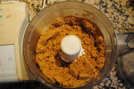 pulverizing the cookies for cheesecake crust